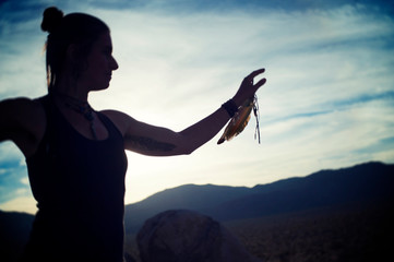 Shamanic Movement Woman on Big Boulders desert twilight qi gong