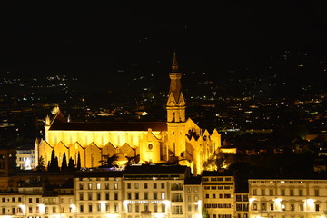 Basilica of Santa Croce dots the Florence skyline at nighttime.