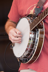 Man playing banjo at a concert