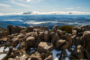 Fototapeta na wymiar The pinnacles rock formation on the summit of Mount Wellington with the view of Hobart the capital and most populous city of the Australian island state of Tasmania