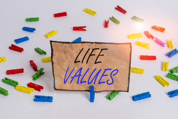 Handwriting text writing Life Values. Conceptual photo things that you believe are important in the way you live Colored clothespin papers empty reminder white floor background office