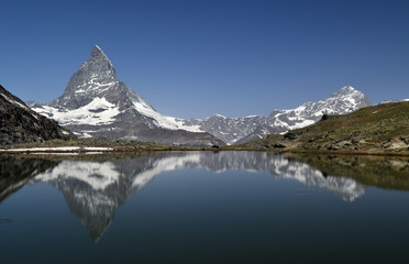 Naklejka premium the reflection of the Matterhorn on the surface of Riffelsee. Switzerland