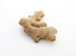 Fresh raw organic ginger root on white background. Overhead of gingers on white background
