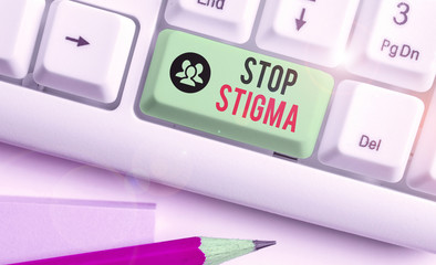 Writing note showing Stop Stigma. Business concept for end the feeling of disapproval that most...
