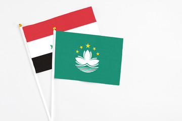 Macao and Iraq stick flags on white background. High quality fabric, miniature national flag. Peaceful global concept.White floor for copy space.