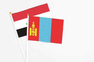 Mongolia and Iraq stick flags on white background. High quality fabric, miniature national flag. Peaceful global concept.White floor for copy space.