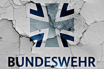flag of Bundeswehr painted on cracked wall
