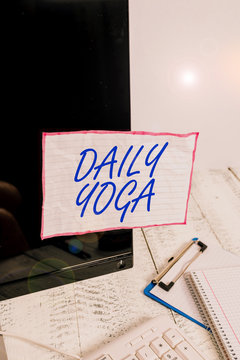 Text sign showing Daily Yoga. Business photo text series of Yoga workouts to train different parts of your body Note paper taped to black computer screen near keyboard and stationary