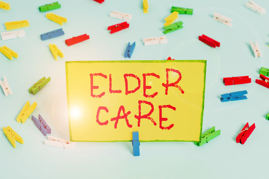 Word writing text Elder Care. Business photo showcasing the care of older showing who need help with medical problems Colored clothespin papers empty reminder blue floor background office pin