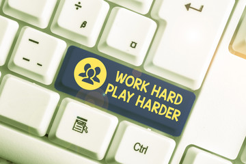 Handwriting text writing Work Hard Play Harder. Conceptual photo a Balance Life Have a Break Destressing to Relax White pc keyboard with empty note paper above white background key copy space