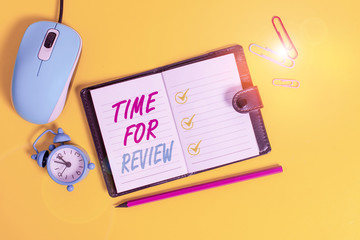 Word writing text Time For Review. Business photo showcasing Evaluation Feedback Moment Perforanalysisce Rate Assess Locked diary sheets clips marker mouse alarm clock colored background