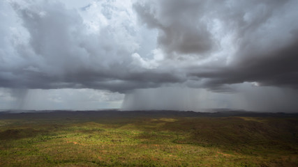 Fototapeta na wymiar Aerial view from a helicopter of Wet Season thunderstorms near Warmu in the remote Kimberley region of Western Australia.