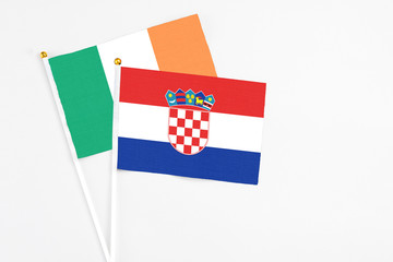 Croatia and Ireland stick flags on white background. High quality fabric, miniature national flag....