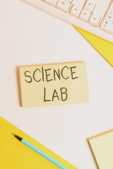 Text sign showing Science Lab. Business photo showcasing special facility where experiments are done and with equipment Flat lay above table with pc keyboard and copy space paper for text messages