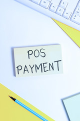 Text sign showing Pos Payment. Business photo showcasing customer tenders payment in exchange for goods and services Flat lay above table with pc keyboard and copy space paper for text messages