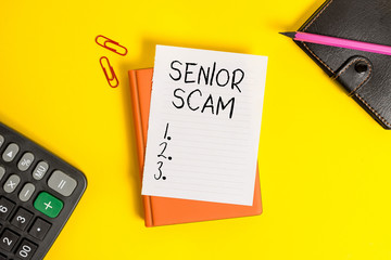 Text sign showing Senior Scam. Business photo showcasing fraud schemes targeting the lifestyle and savings of the elderly Pile of empty papers with copy space on the table