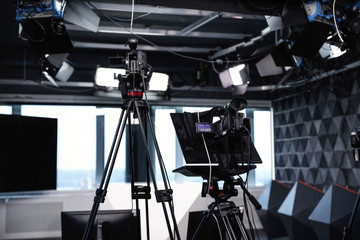 Modern video recording studio with professional cameras