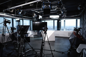 Modern video recording studio with professional cameras