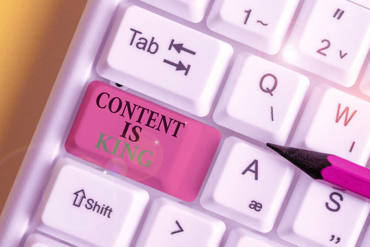 Conceptual Hand Writing Showing Content Is King. Concept Meaning Words What Sells Products And Provide Good Marketing White Pc Keyboard With Note Paper Above The White Background