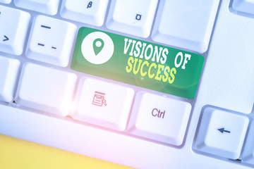Writing note showing Visions Of Success. Business concept for Clear End Result of Purpose Goal Perspective Plan White pc keyboard with note paper above the white background