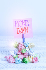 Writing note showing Money Drain. Business concept for To waste or squander money Spend money...