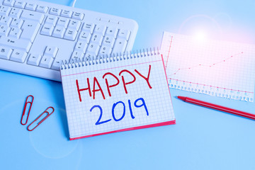 Conceptual hand writing showing Happy 2019. Concept meaning feeling showing or causing pleasure or satisfaction for 2019 Paper blue keyboard office study notebook chart numbers memo