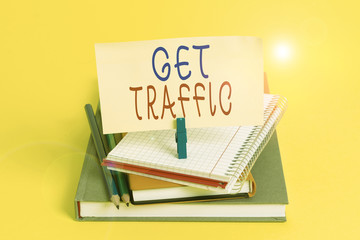 Conceptual hand writing showing Get Traffic. Concept meaning amount of data sent and received by visitors to a website Book pencil rectangle shaped reminder notebook clothespins