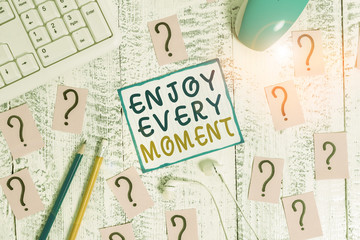 Writing note showing Enjoy Every Moment. Business concept for being pleased with your life Have fun...