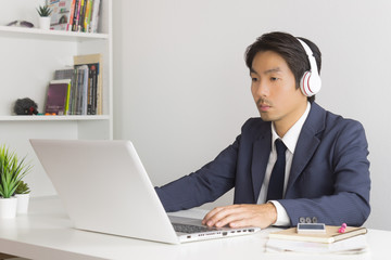 Asian Man Call Center Wear Headset Service Customer Via Internet