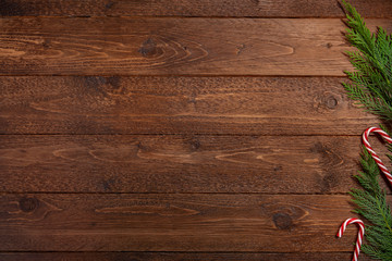 Christmas, winter, new year concept. Cypress branches on dark, wooden  background. Flat lay, top view.