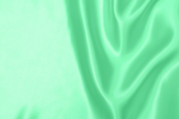 green satin fabric texture soft blur background