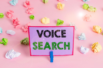 Writing note showing Voice Search. Business concept for allows the user to use a voice comanalysisd to search the Internet Colored crumpled papers empty reminder pink floor background clothespin