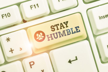Conceptual hand writing showing Stay Humble. Concept meaning not proud or arrogant Modest to be...