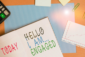 Handwriting text writing Hello I Am Engaged. Conceptual photo He gave the ring We are going to get married Wedding Striped paperboard notebook cardboard office study supplies chart paper