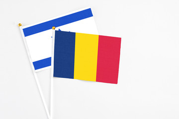Chad and Israel stick flags on white background. High quality fabric, miniature national flag....