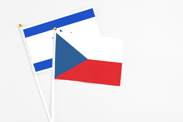 Czech Republic and Israel stick flags on white background. High quality fabric, miniature national flag. Peaceful global concept.White floor for copy space.