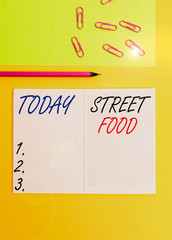 Handwriting text writing Street Food. Conceptual photo cooked food sold by vendors in a street or other public location Blank squared notebook pencil marker paper sheet plain colored background