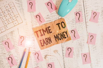 Text sign showing Time To Earn Money. Business photo showcasing Get Paid for Work Done Invest on Business or Property Writing tools, computer stuff and scribbled paper on top of wooden table