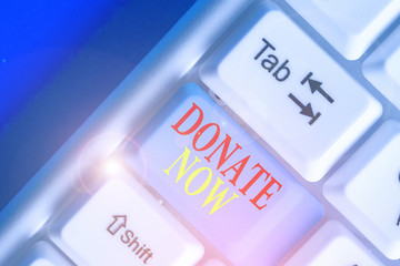 Conceptual hand writing showing Donate Now. Concept meaning to give something like money or goods...