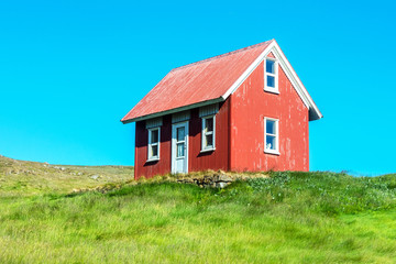 Fototapeta na wymiar Red House, Green Grass, Blue Sky. 