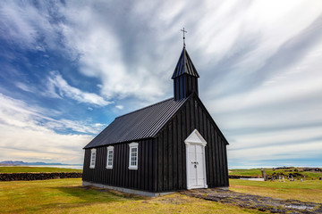 Fototapeta na wymiar The Little black church of Budir, Buoakirkja Black Church, On the south coast of Snæfellsnes peninsula In the West of Iceland.