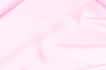 Plastic pink satin fabric texture soft blur background