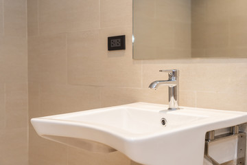 White sink with water faucet decoration in bathroom