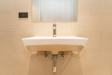 White sink with water faucet decoration in bathroom