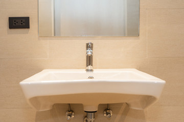 White sink with water faucet decoration in bathroom