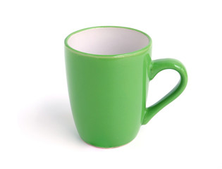 Empty green mug for coffee or tea isolated on white background..