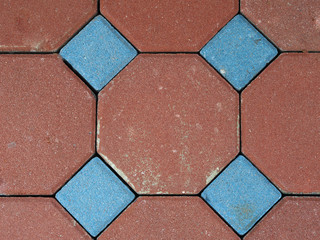 The surface of the blue and red stone brick floor background texture.