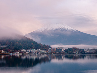 Calm and tranquil scene of mt.Fuji under cloudy sky and fog in the morning , View from Kawaguchiko lake , Yamanashi , Japan