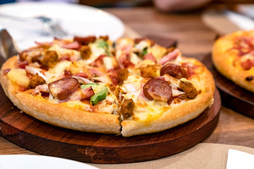  Pizza on wooden table in restaurant