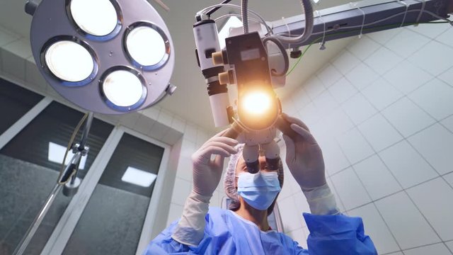Modern microscope for eye operation at the hospital. Health care concept. Doctor preparing for operation, eye desease treatment.